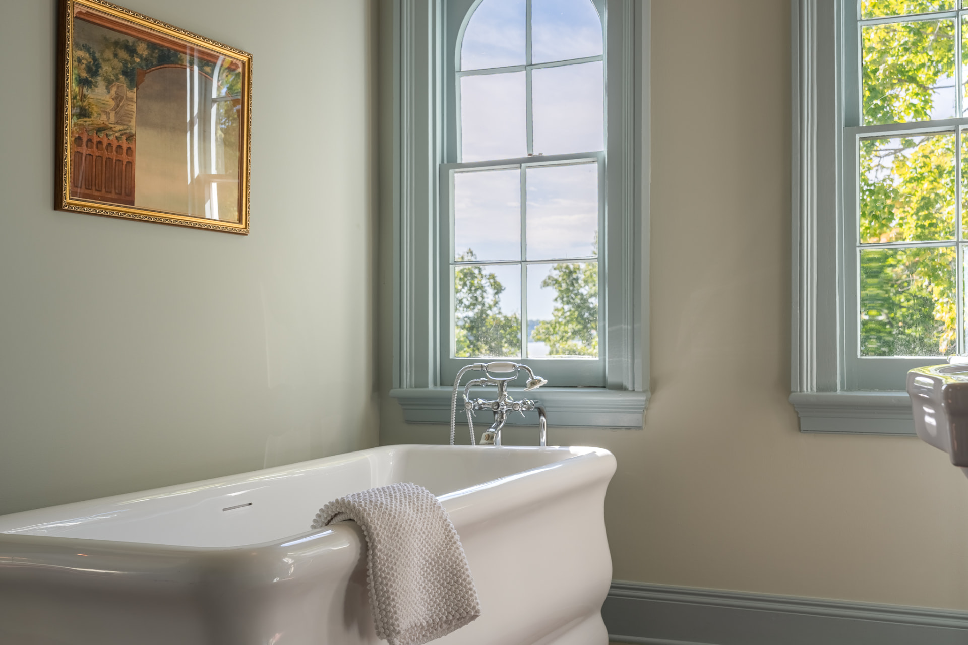 Soaking tub beneath the windows of a Main House bath