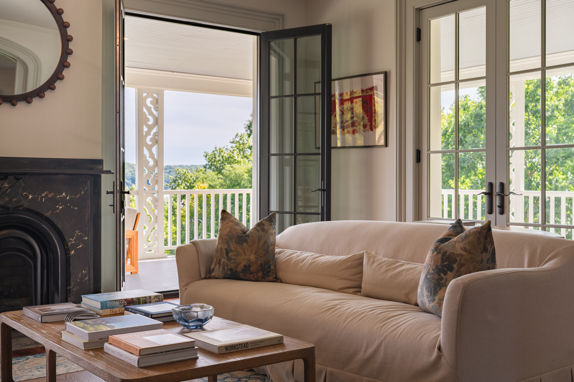 Sunlit sitting room with doors to the porch